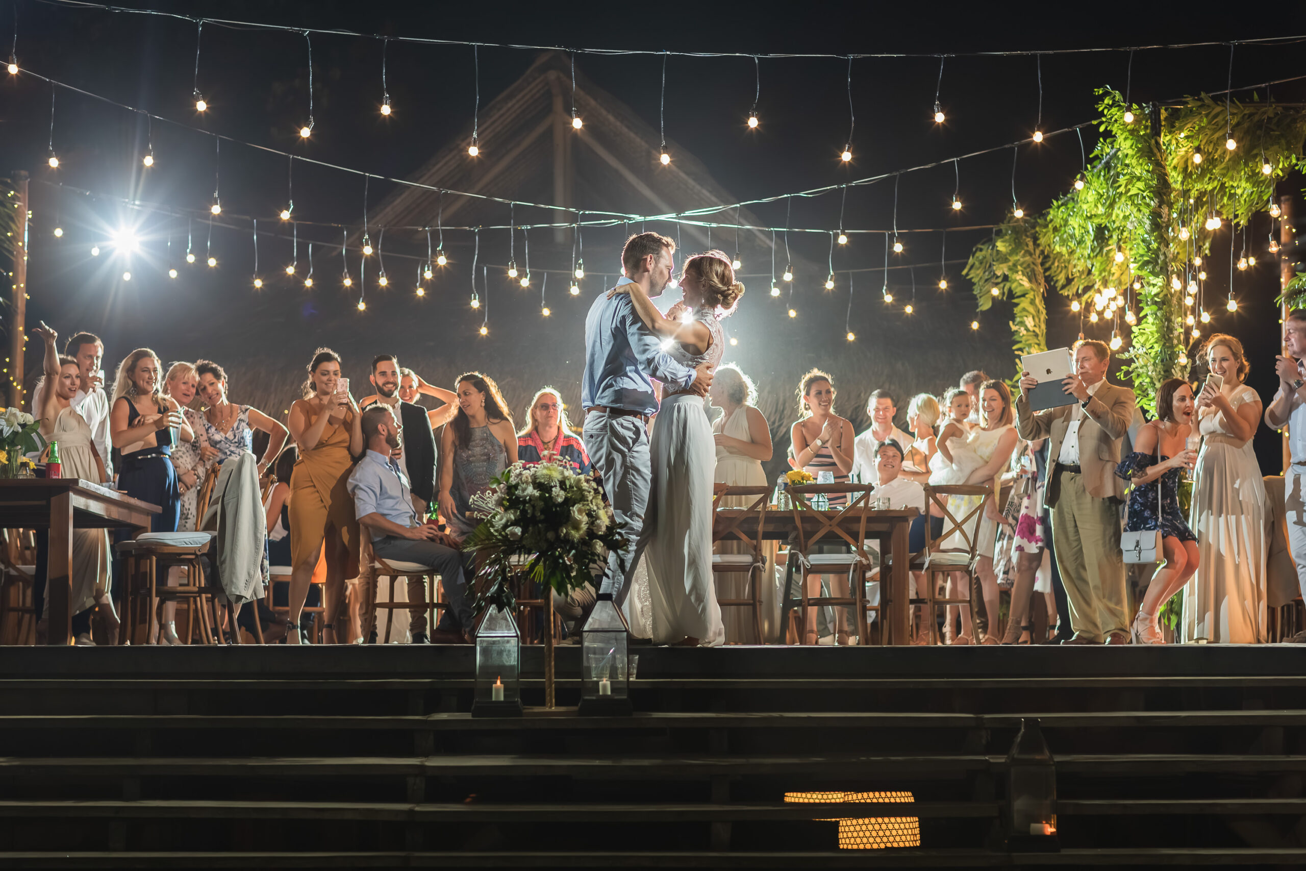 Candlelit wedding ceremony seating at sunset at Komune Resort, Bali