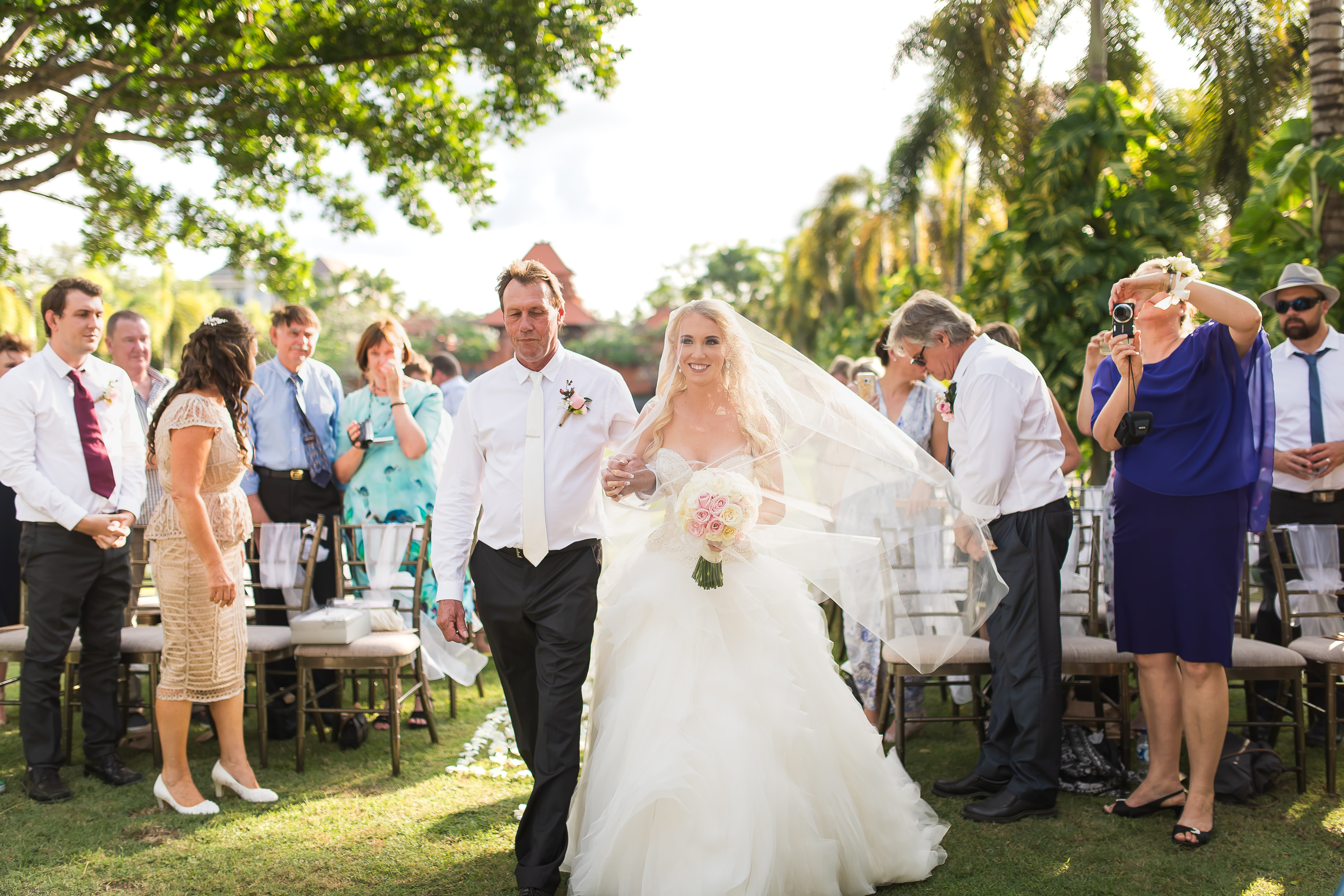 Taman Bhagawan Wedding - Bride walking to the ceremony with family