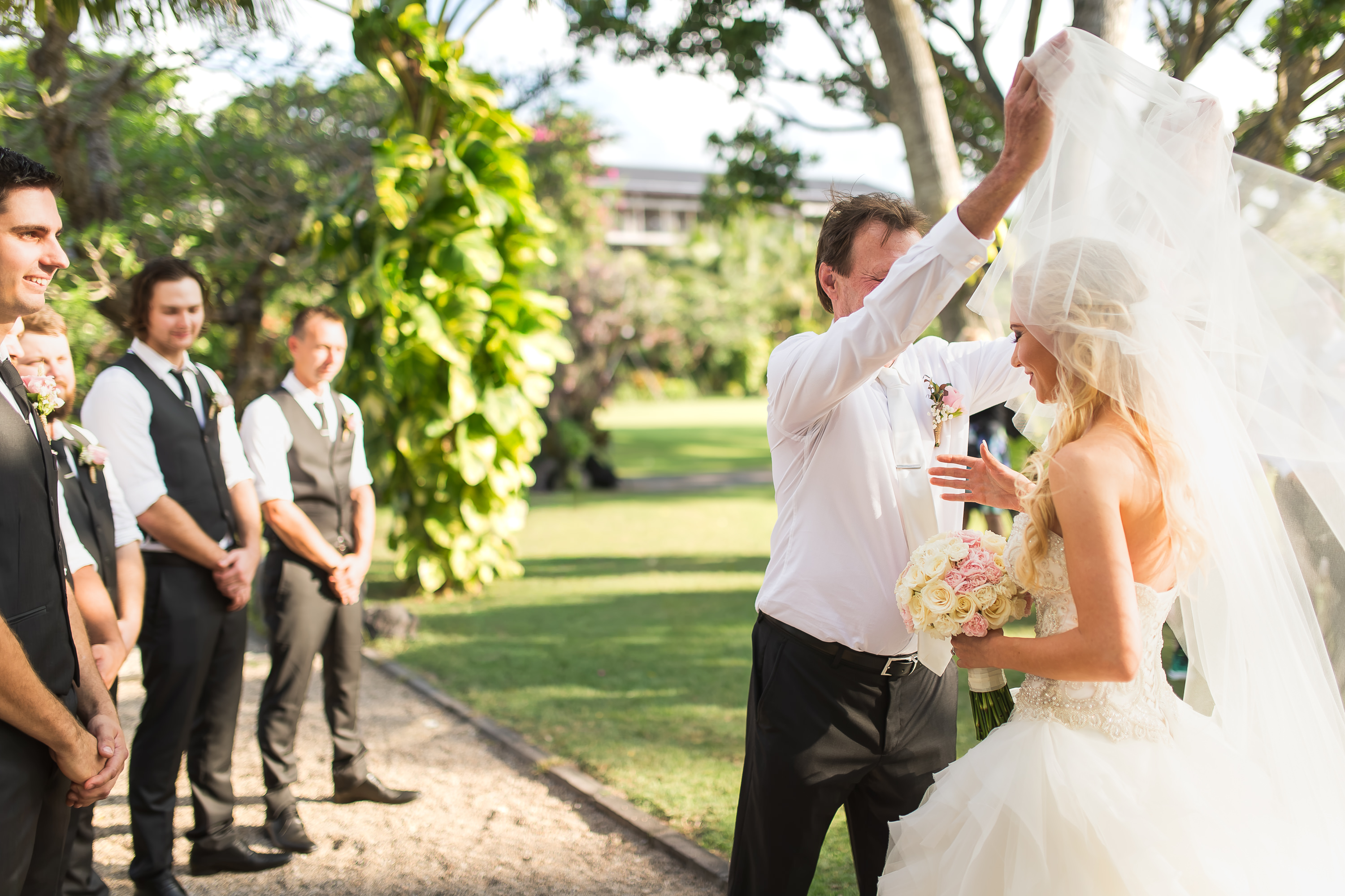 Taman Bhagawan Wedding - Groom lifting the bridal veil