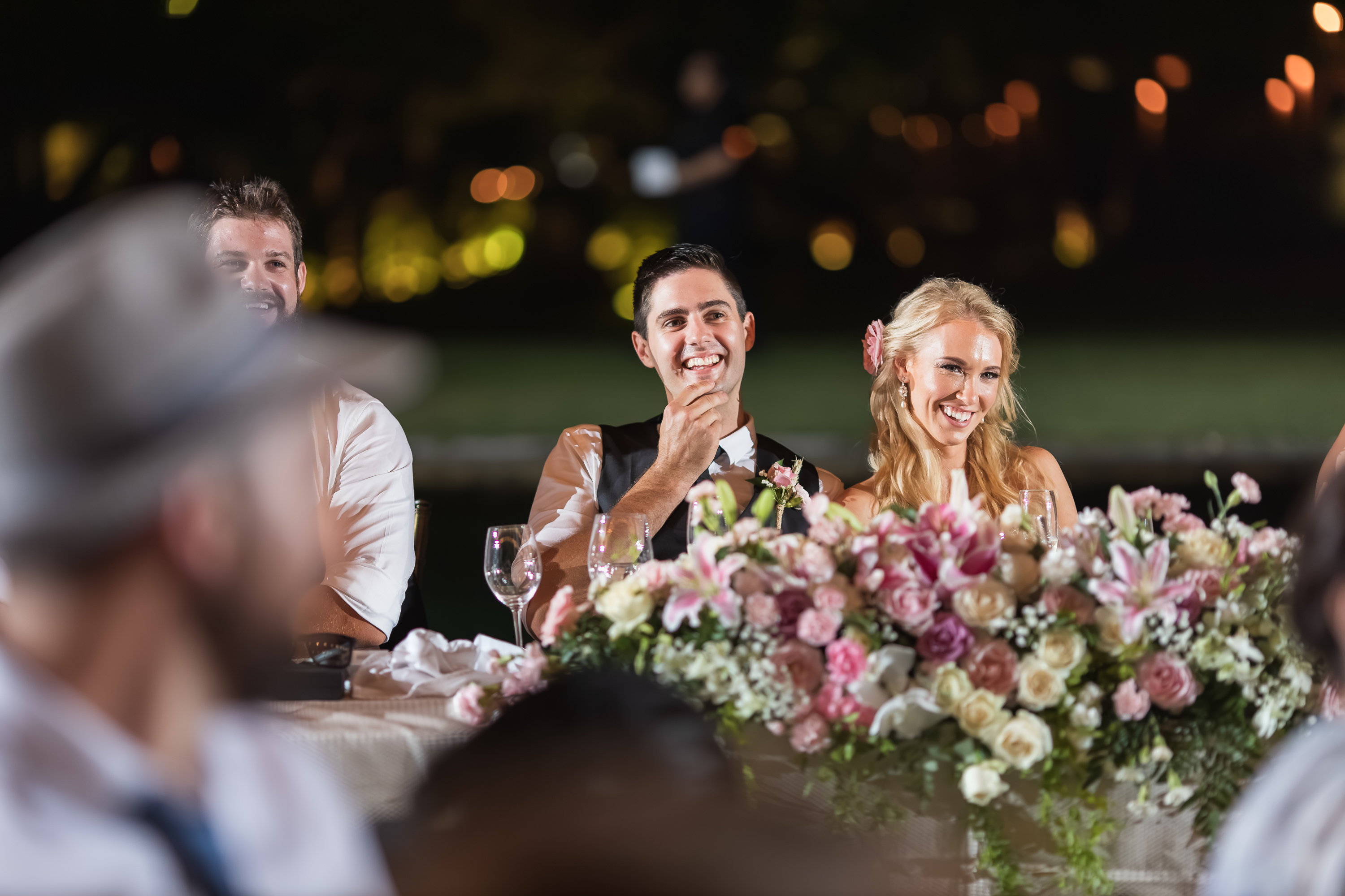 Taman Bhagawan Wedding - Couple laughing at the reception table