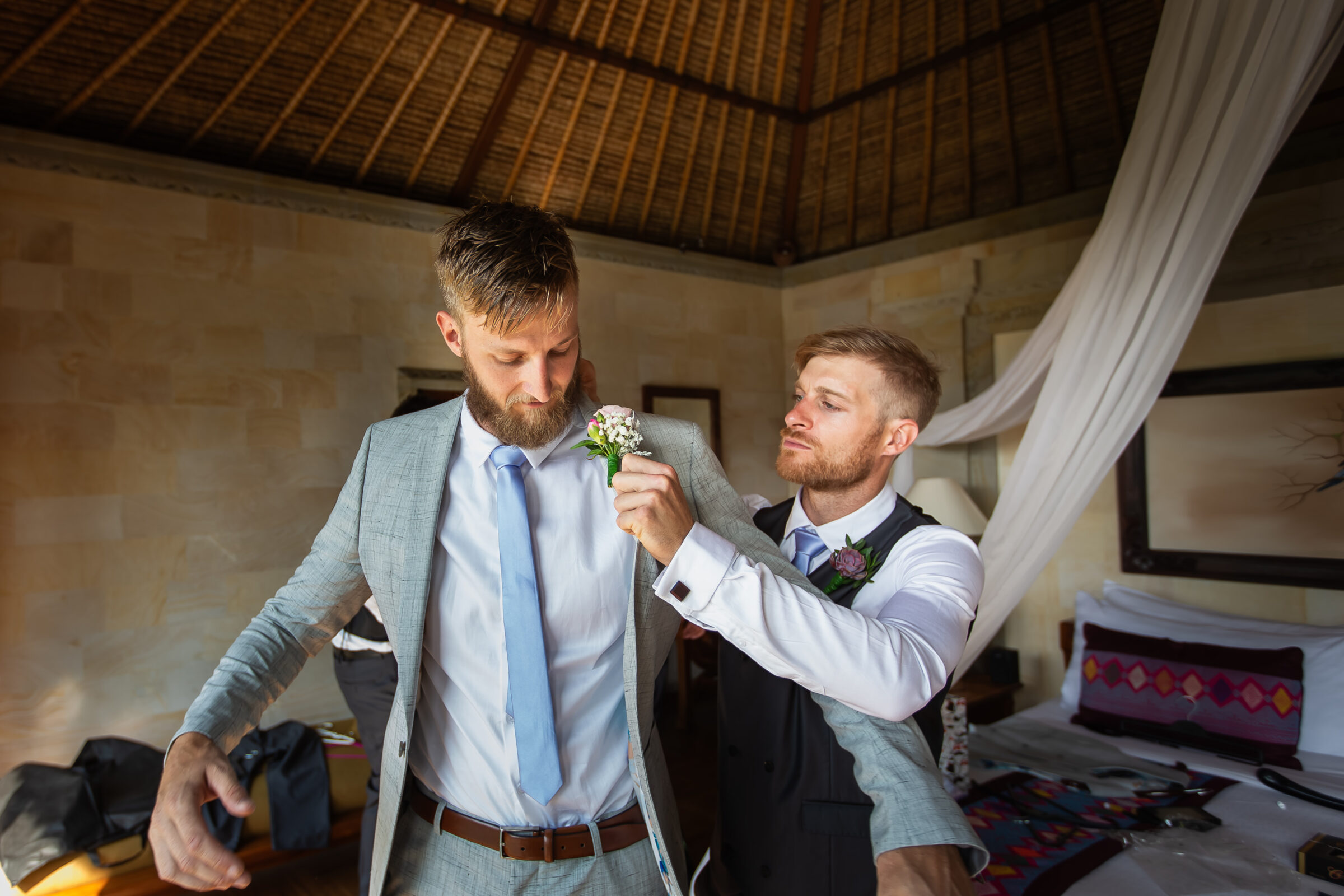 The Royal Pita Maha - groomsman pinning the boutonniere