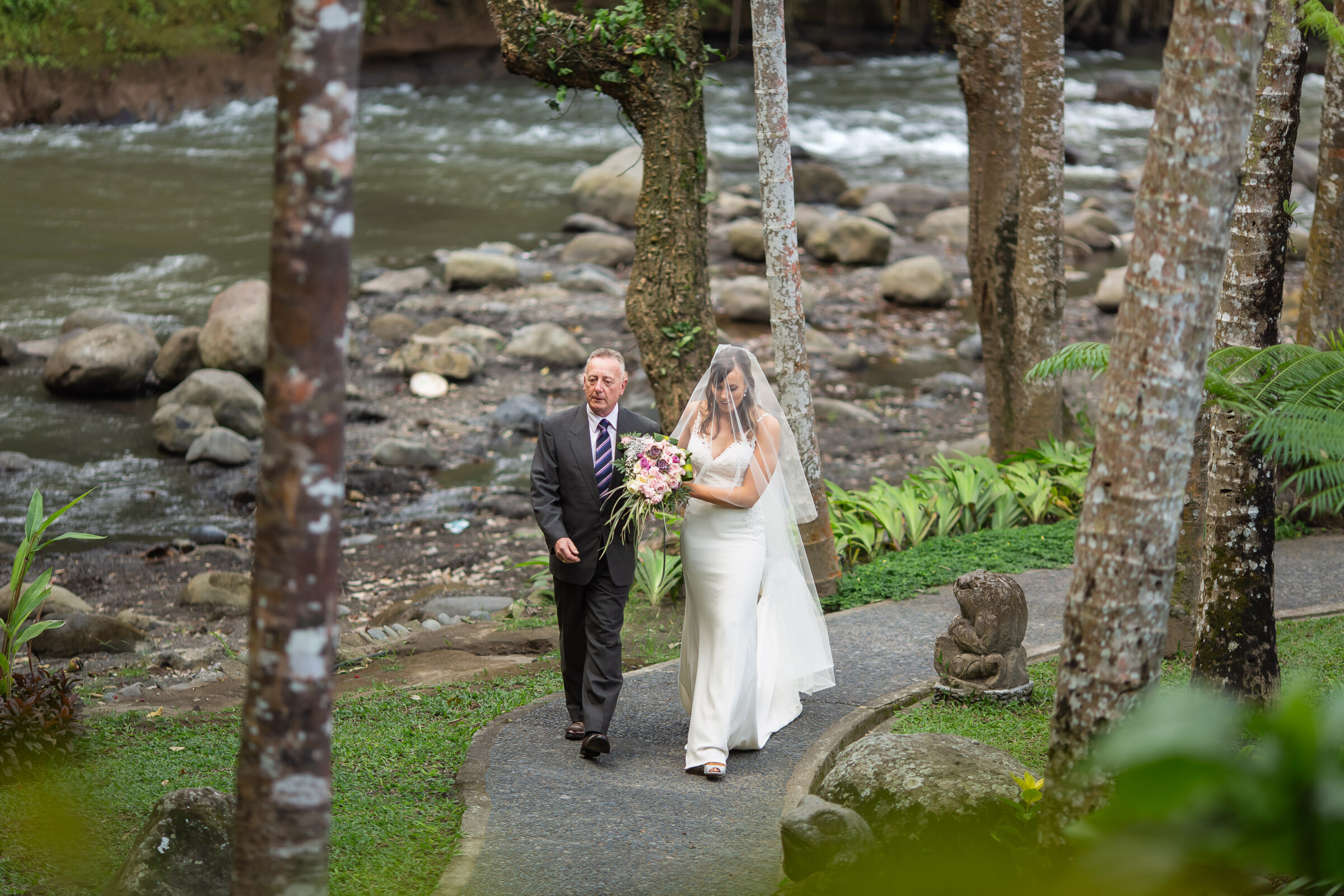 The Royal Pita Maha - bride and father on the river path